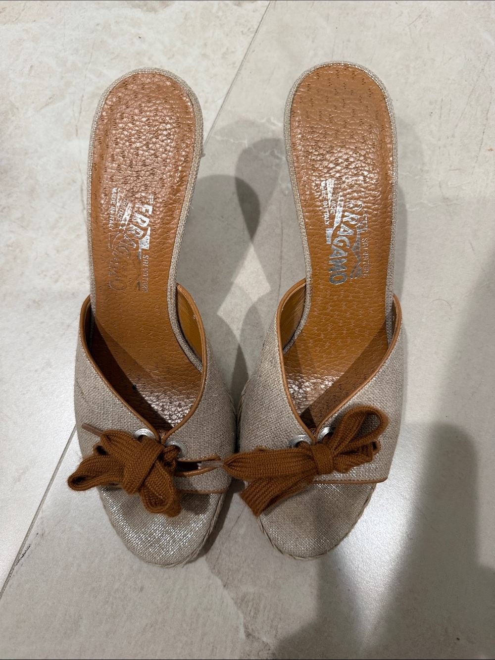 Salvatore Ferragamo Metallic Cream Mules with Brown Bow